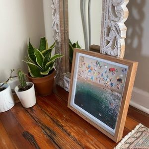 Beach aerial framed by Marmont Hill “Packed Beach”